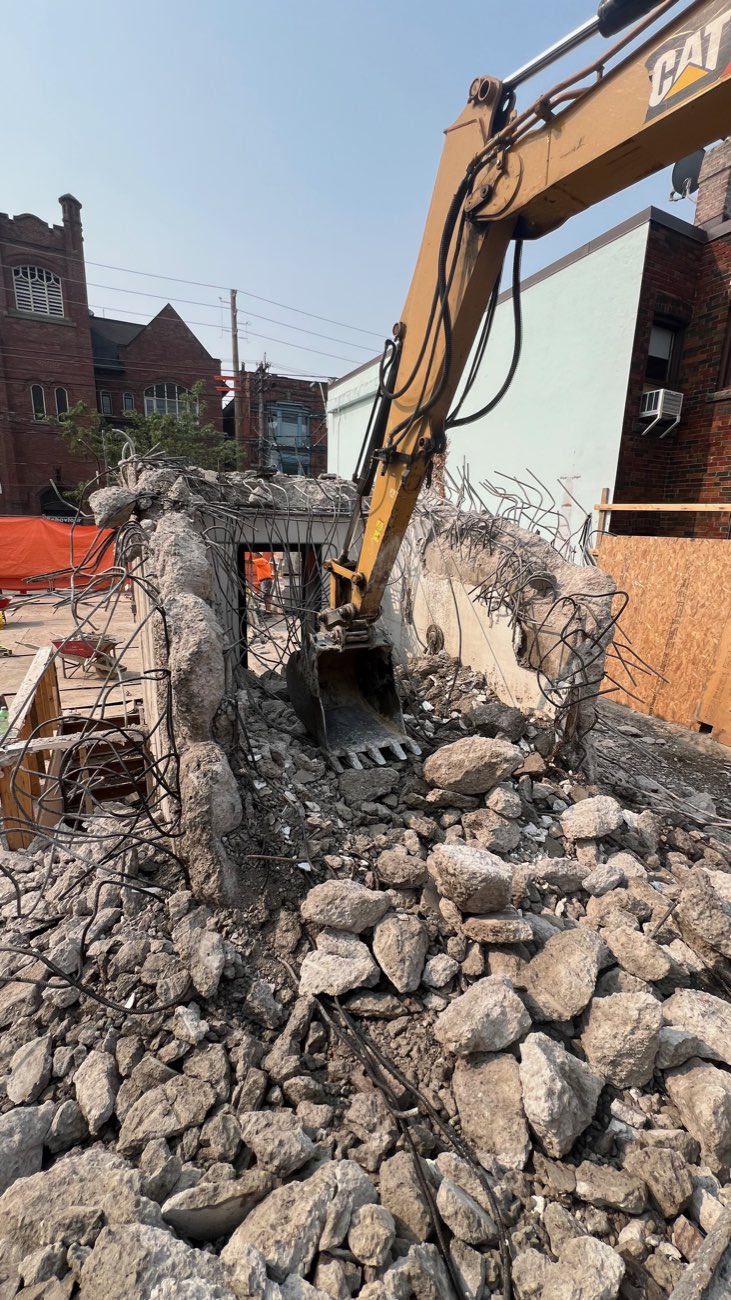 Teston excavator breaking out a concrete structure in the GTA