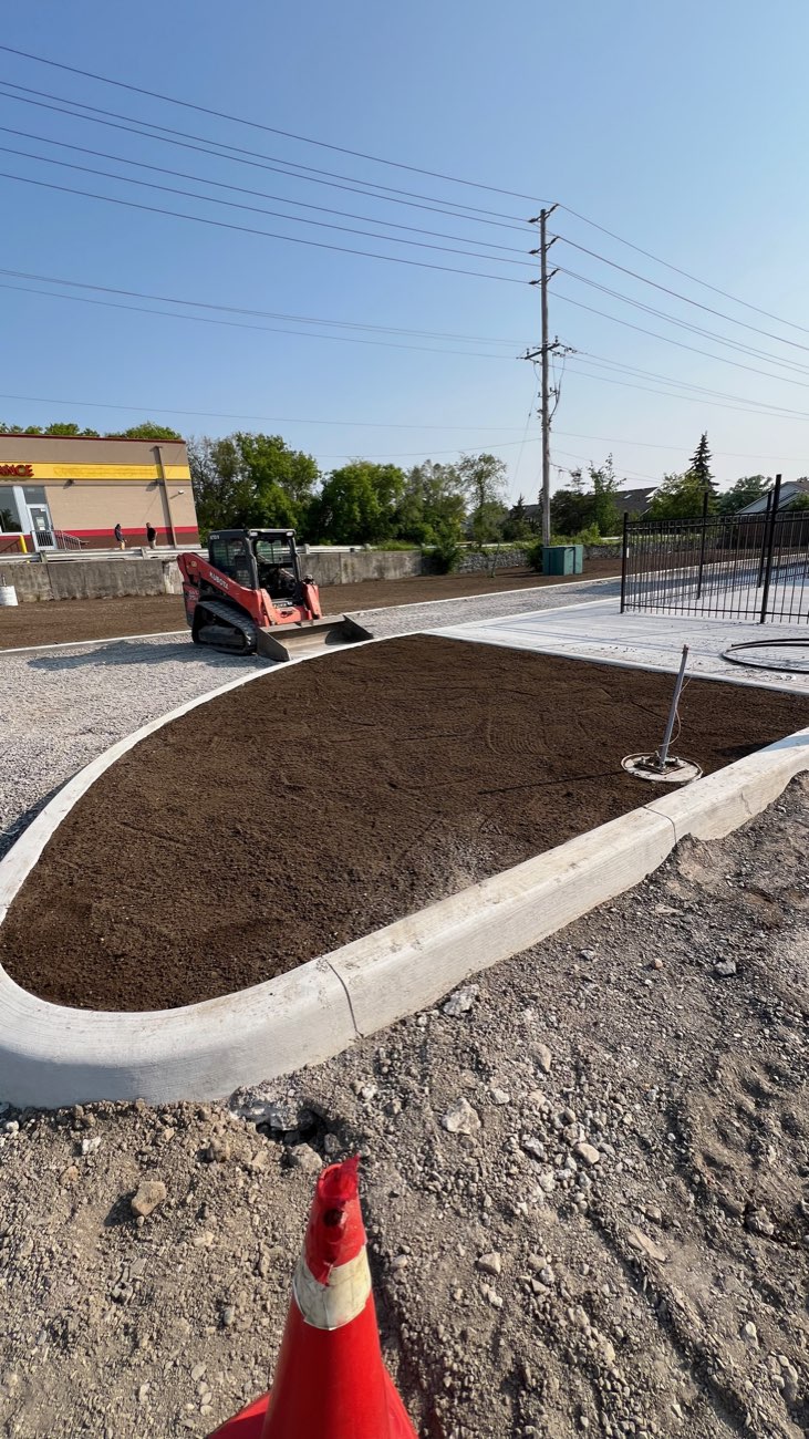 Teston operator grading a commercial site in the GTA