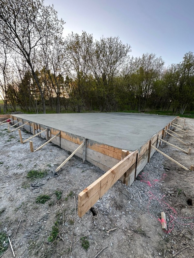 Large finished concrete foundation slab with formwork